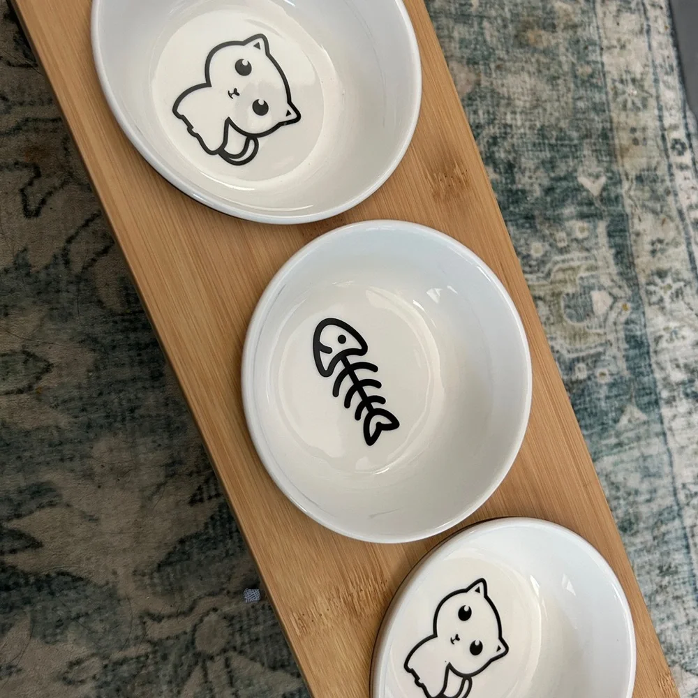 White Ceramic Cat Bowls on Bamboo Tray